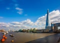 London, England - The Shard, London`s highest skyscraper with the iconic Tower Bridge at background Royalty Free Stock Photo