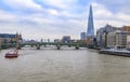 London, England skyline with the Shard, Southwark Bridge and Tower Bridge on Thames river during the day