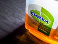 Close-up of Dettol bottle, with narrow focus on the logo name.