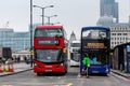 London, England, UK - December 31, 2019: Several traditional double-decker buses at the intersection behind London Bridge await