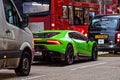 London, England, UK - December 31, 2019: Traffic jam in London center with expensive green supercar in the evening hours Royalty Free Stock Photo