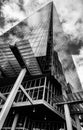 Black And White Image Of The Shard Skyscraper Reflecting Clouds In Its Glass Facade