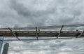 Millennium bridge hangs in sky, London, England, UK
