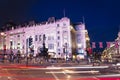 London, England, United Kingdom: 16 June 2017 - Popular tourist Picadilly circus with flags union jack in night lights Royalty Free Stock Photo