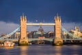 London, England - The world famous Tower Bridge at golden sunrise with red double-decker bus Royalty Free Stock Photo