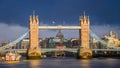 London, England - The world famous Tower Bridge at golden sunrise with red double-decker bus. St.Paul`s Cathedral Royalty Free Stock Photo