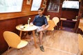 Matured Indian Man Sitting in Cafe