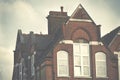 London Europe. Primary school top floor and roof on blue sky background. Royalty Free Stock Photo