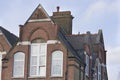 London Europe. Primary school top floor and roof on blue sky background Royalty Free Stock Photo