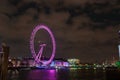 London Eye Illuminated in Purple at Night, Reflecting on Thames River