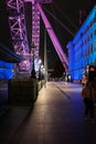 Beside the London Eye  lit by purple light. Side structure being lit also with blue light. Royalty Free Stock Photo