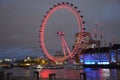 london eye at night on the river thames in london