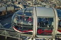 The london eye pod having the people who are having drinks and other things on board Royalty Free Stock Photo