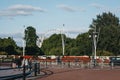 London Eye seen over the trees from outside Buckingham Palace, London, UK Royalty Free Stock Photo