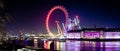 A panorama of he London eye at night Royalty Free Stock Photo