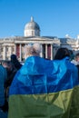 Two girls with a Ukranian flag in front of the National Gallery at an anti war protest in London