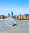 London Fire Brigade demonstrate the power of their water hose from their boat