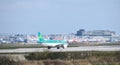 An Aer Lingus Airbus A320-214 moves towards take off at Gatwick Airport passing in front of many British Airways and easyJet plane