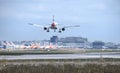 A British Airways Airbus A319-131 callsign G-DBCA comes into land at Gatwick Airport over many grounded aeroplanes due to Covid-19