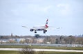 A British Airways Airbus A320-232 callsign G-MIDX comes in to land at Gatwick Airport, with the Lowfield Heath church spire