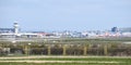 View of the air traffic control tower at Gatwick Airport with lots of British Airways, Tui and easyJet grounded planes Royalty Free Stock Photo