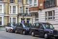 London, Great Britain. April 12, 2019. Kensington street. Cab parking. London cab is considered the best taxi in the Royalty Free Stock Photo