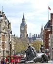 LONDON, GREAT BRITAIN: Big Ben and lion on Trafalgar Square Royalty Free Stock Photo