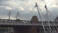 London Hungerford Bridge and Golden Jubilee Bridges Image with People Walking