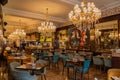 London: Inside upscale Cafe Concerto in Covent Garden with beautiful chandeliers and paintings