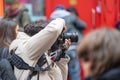 London, January 26, 2020. Photographer taking photos in London Chinatown. Chinese New Year Celebrations. Selective focus