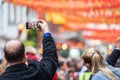 London, January 26, 2020. Spectators taking pictures with cell phones during Chinese New Year Celebrations Royalty Free Stock Photo