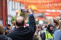 London, January 26, 2020. Spectators taking pictures with cell phones during Chinese New Year Celebrations Royalty Free Stock Photo