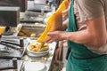 LONDON - JUN 12, 2015: Cheese raclette with potatoes at the market. Borough Market, London, UK.