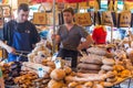 LONDON - JUN 12, 2015: Unidentified people purchase bread at a bakery in Borough Market, London, UK.