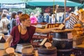 LONDON - JUN 12, 2015: Unidentified visitors at a Cheese stall at Borough Market. Borough Market is the largest gourmet food