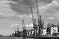 LONDON - JUNE 25 : Old dockside cranes alongside a waterfront de Royalty Free Stock Photo