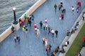 LONDON, Lots of people walking by river Thames. City of London in weekend