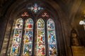 Stained glass window illustrated Bible stories in the St Mary Abbots Church, Kensington