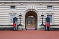 LONDON - MAY 17: British Royal guards guard the entrance to Buckingham Palace on May 17, 2013