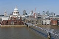 The London Millennium Bridge, a suspension footbridge crossing the River Thames in London and St Paul Cathedral seen in background Royalty Free Stock Photo