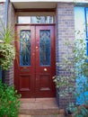 London, Notting hill, entrance with folliage and wooden door