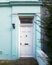 London, Notting hill, vintage house light blue front with white door Royalty Free Stock Photo