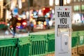 Hand sanitiser station with out of focus traffic headlights in the background Royalty Free Stock Photo