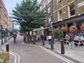 London, old street with quaint shops and pubs.