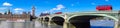 London panorama with red buses on bridge against Big Ben in England, UK