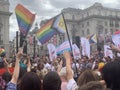 Gay activists with LGBT flags at the Pride parade in London , England 2023