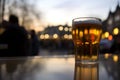 London pub outdoors, pint of beer, riverside on sunset, AI generative