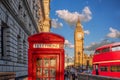 London with red phone booth against Big Ben in England, UK Royalty Free Stock Photo