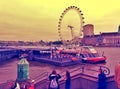 London's eye with tourists outdoor london UK