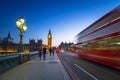 London scenery at Westminster bridge with Big Ben and blurred red bus Royalty Free Stock Photo